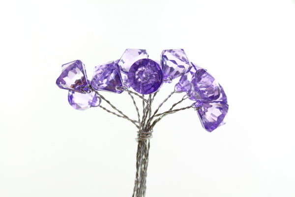 The Purple on silver acrylic diamond shaped bead on a wire stem.
