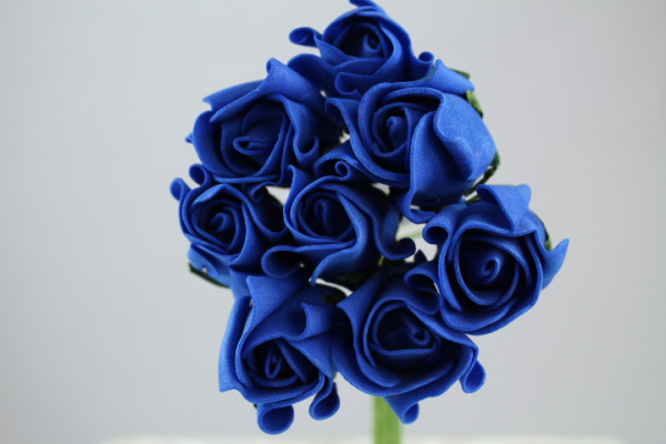 Royal blue Rolled Roses in bunches of eight.
